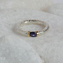 Load image into Gallery viewer, Iolite gemstone set into a silver and gold tension ring