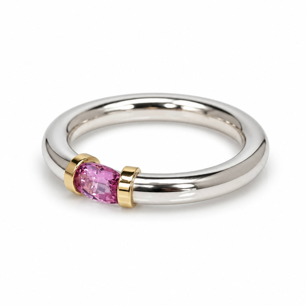 A Sterling Silver Pink Sapphire Tension Set Ring With Gold Detail