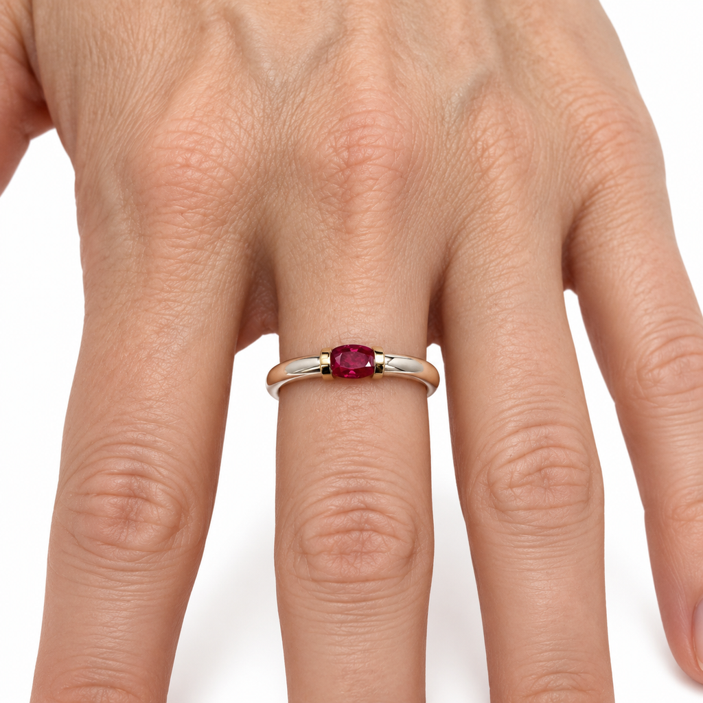 A Sterling Silver Ring With A Natural Ruby And Gold Decoration