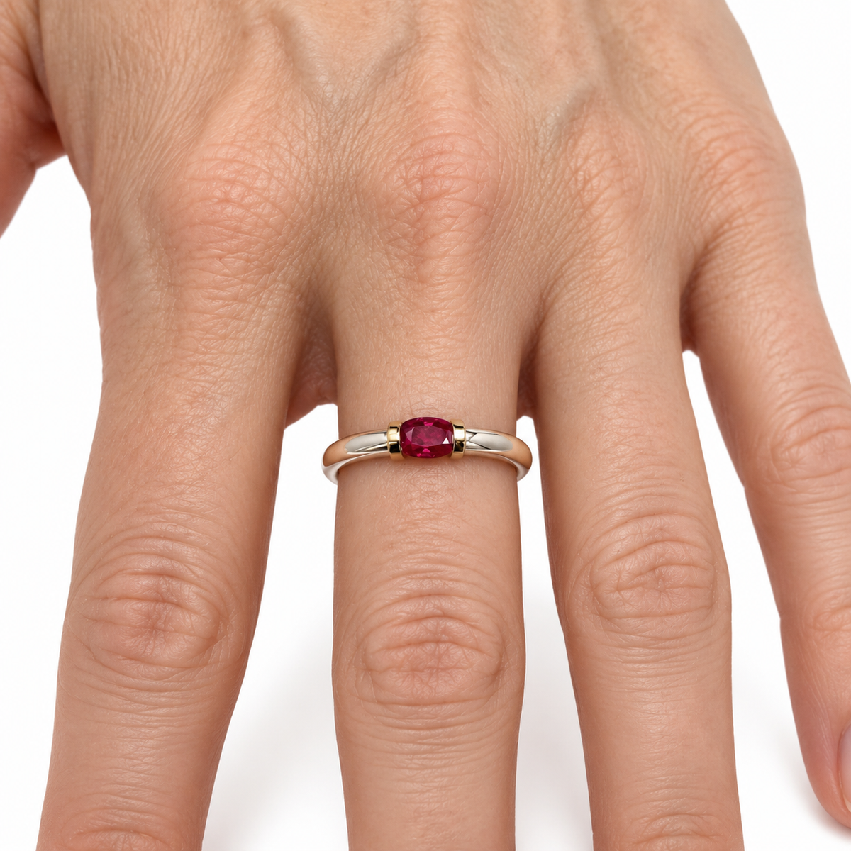 A Sterling Silver Ring With A Natural Ruby And Gold Decoration