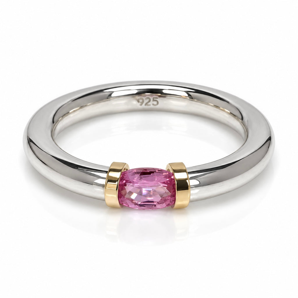 A Sterling Silver Pink Sapphire Tension Set Ring With Gold Detail