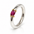 A Sterling Silver Ring With A Natural Ruby And Gold Decoration