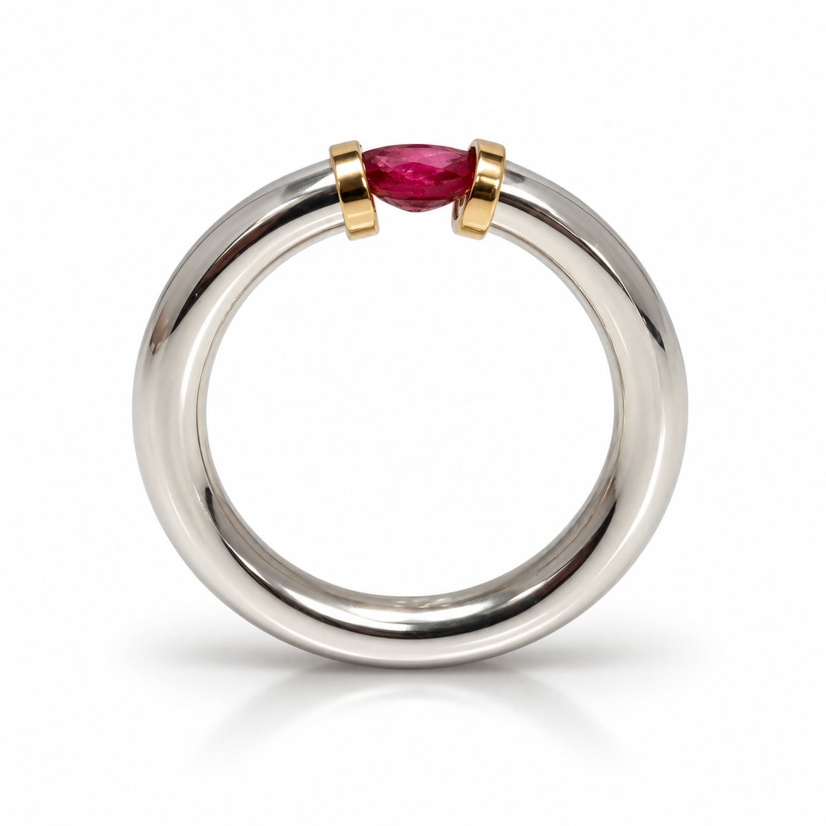 A Sterling Silver Ring With A Natural Ruby And Gold Decoration