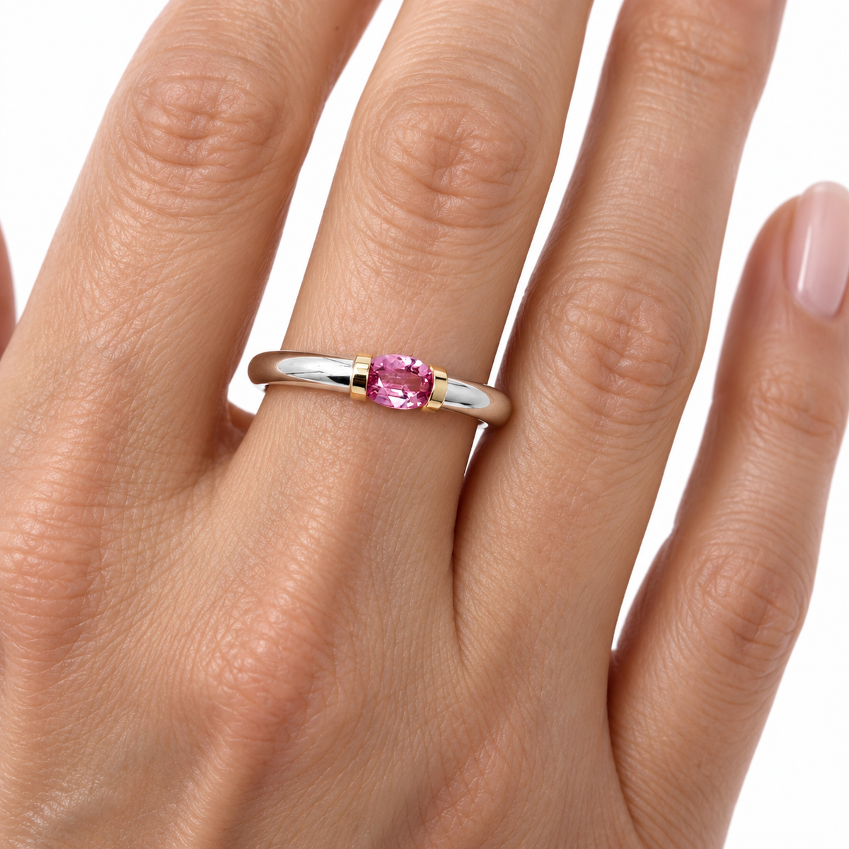 A Sterling Silver Pink Sapphire Tension Set Ring With Gold Detail