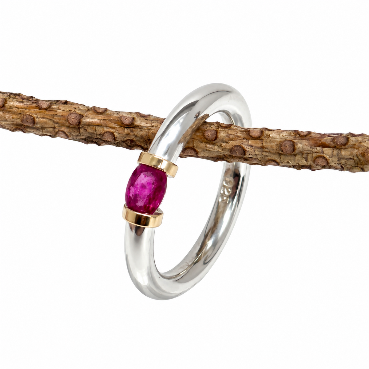 A Sterling Silver Ring With A Natural Ruby And Gold Decoration