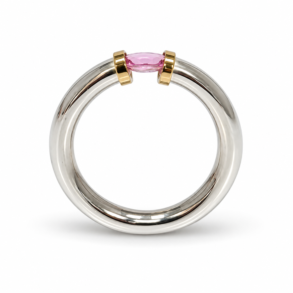 A Sterling Silver Pink Sapphire Tension Set Ring With Gold Detail