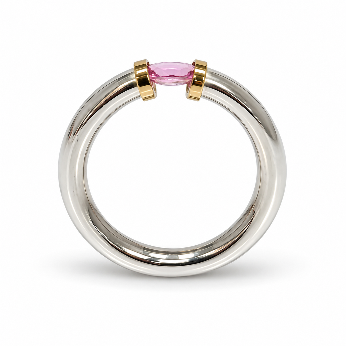 A Sterling Silver Pink Sapphire Tension Set Ring With Gold Detail