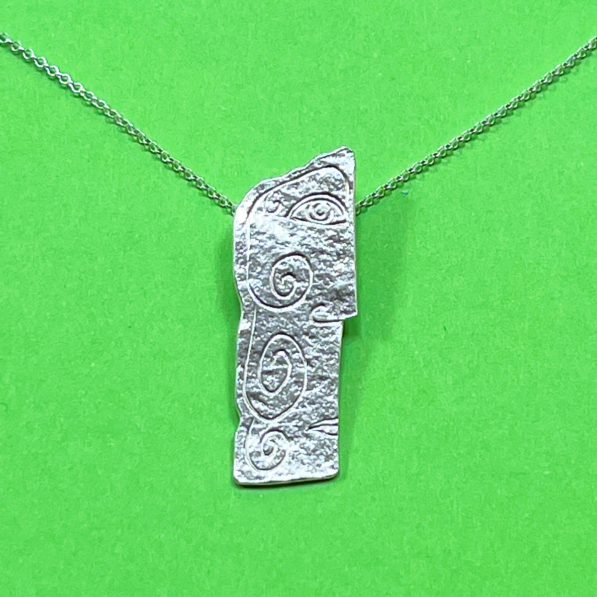 Long Sterling Silver Rock Carving Pendant