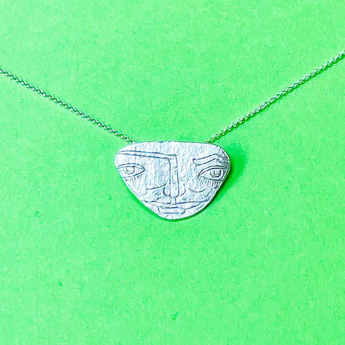 Silver face mask necklace