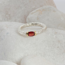Load image into Gallery viewer, An African Garnet hand textured Sterlin Silver ring with a Gold shoulder decoration
