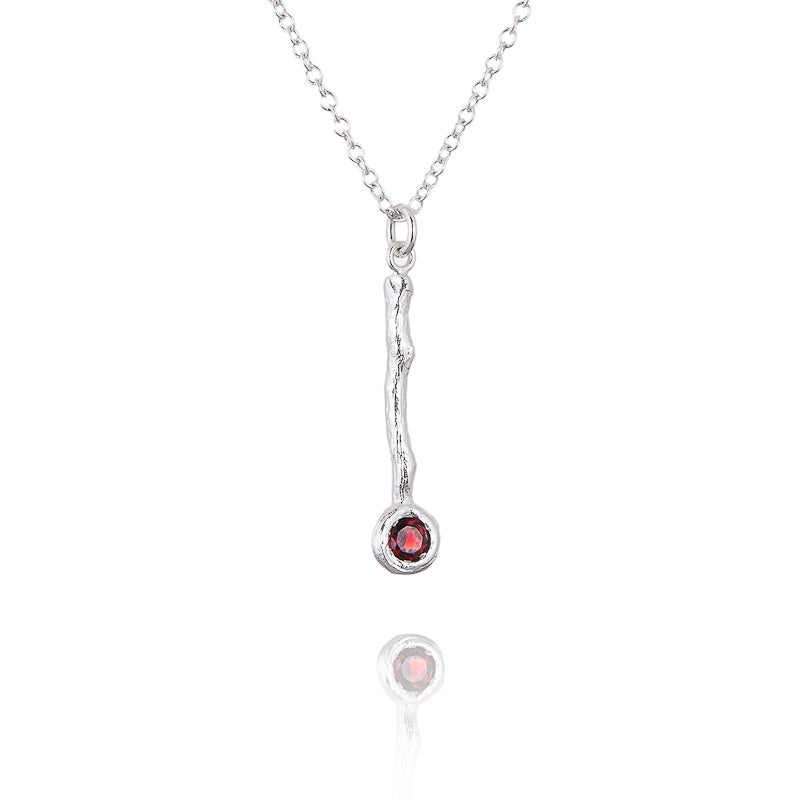 A garnet twig pendant in sterling silver