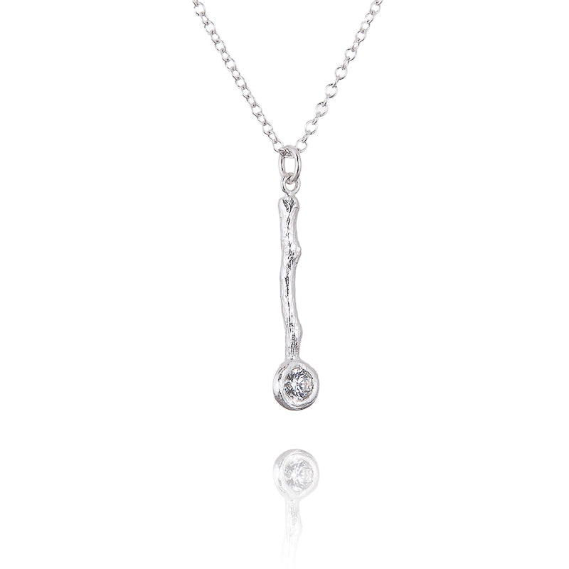 A silver and cubic zirconium woodland style pendant
