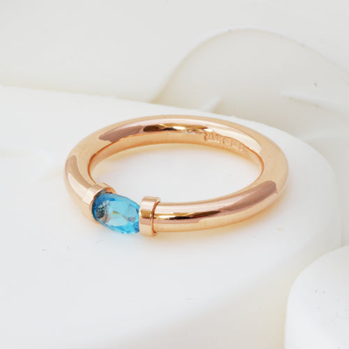 red gold blue topaz ring