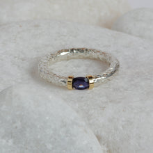 Load image into Gallery viewer, Iolite gemstone set into a silver and gold tension ring
