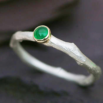 An Emerald Ring in Sterling Silver and Gold.