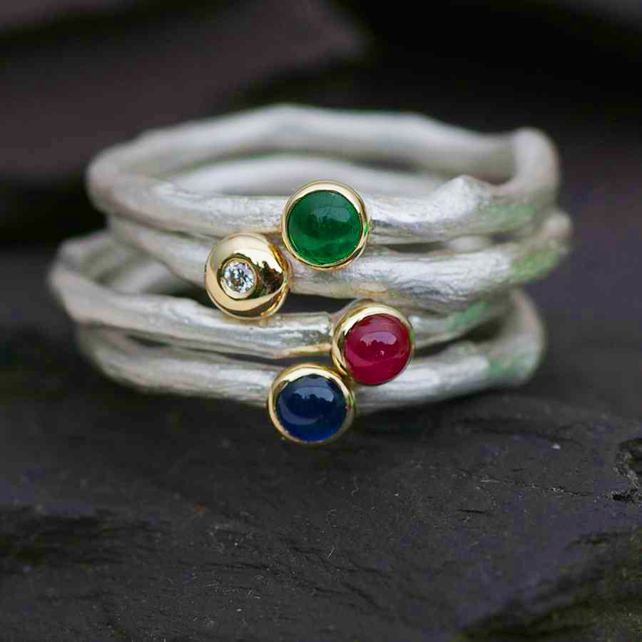 An Emerald Ring in Sterling Silver and Gold.