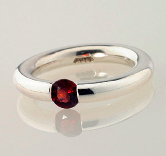 Plain Tension Ring with a Mozambique Garnet